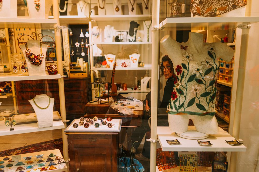 Colorful handmade jewelry displayed in a boutique, featuring artistic necklaces and decorative items.