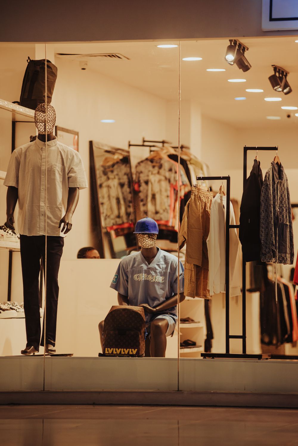 Stylish clothing store display featuring mannequins with trendy outfits and accessories.